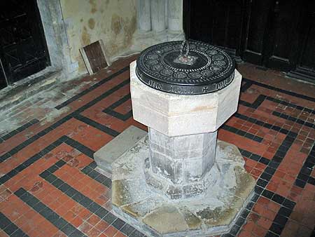 Font and tile maze in Bourn Church