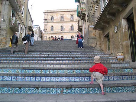 Child climbing La Scala steps