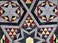 Wall with mosaic geometric inlay