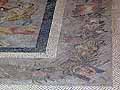 Roman mosaic border with an image of a mask